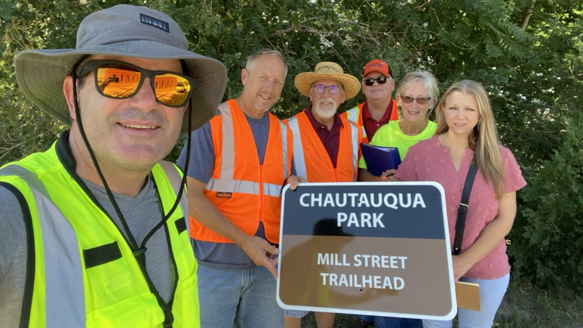 construction crew around trail sign